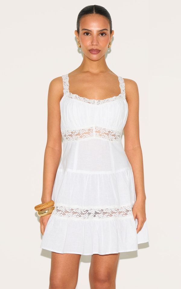 001900e602d85047bd0c8dc0a3ca24e239822afa_CNM4417_1_petite_white_tiered_mini_dress_with_lace_details