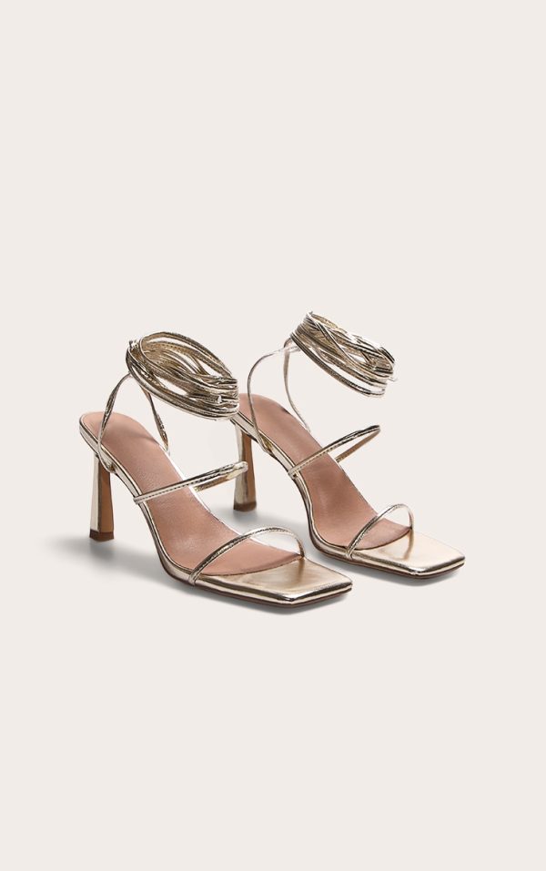 028016e7e0386b62257dd74b6b37049dd7ec5773_CNL7030_2_gold_pu_square_toe_strappy_lace_up_mid_stiletto_heeled_sandals