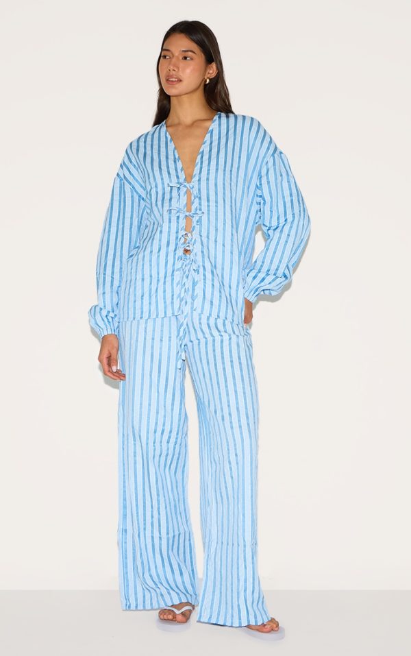 0294417ca0d4742d3a0ccdd4fabc6d5fc50da4de_CNM1732_1_blue_striped_textured_tie_drawstring_wide_leg_trousers