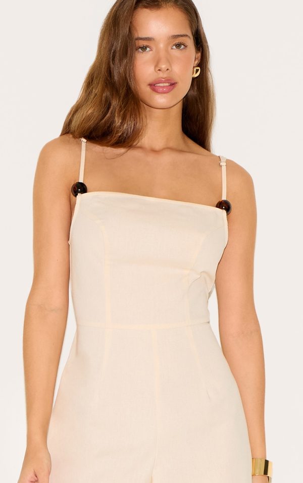03a8bbf9e2ce3debdb6c7476e513894c02486d8d_CNM7291_4_natural_linen_blend_boat_neck_bead_detail_jumpsuit