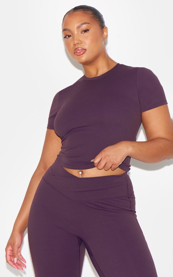 03fb9fc6710d72c0296e3bbcccb0e12a836fd835_CNM0256_9_dark_plum_sculpt_short_sleeve_longline_gym_top