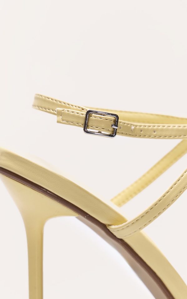 07e0edd849a1e6ad9bb6d23a17171b18cd7a3303_CNL6463_4_lemon_pu_round_toe_asymmetric_strap_high_stiletto_heeled_sandals