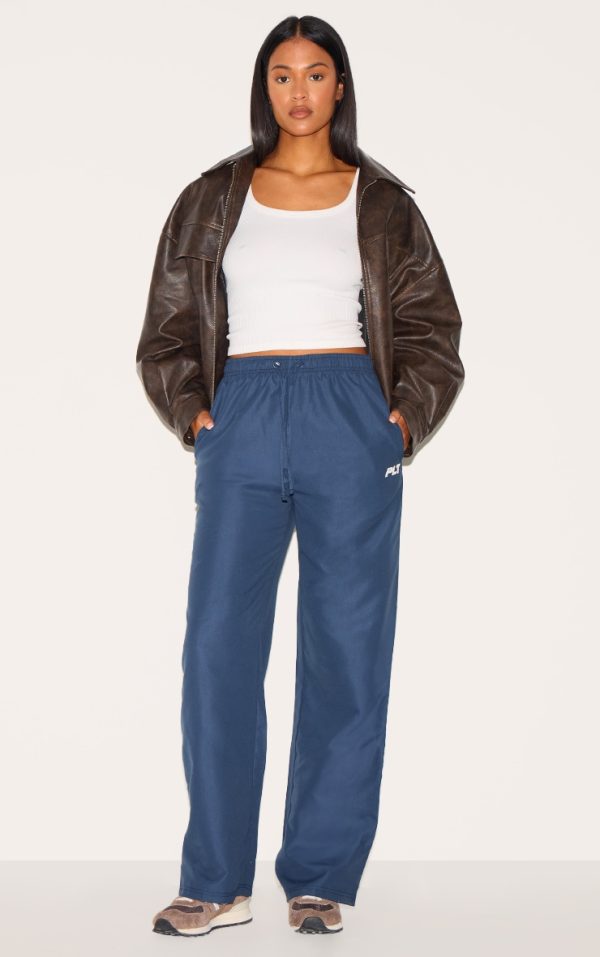 0936502cd1bd36210529870ef4540796e801d335_CNL8298_1_prettylittlething_tall_navy_shell_drawstring_wide_leg_trousers