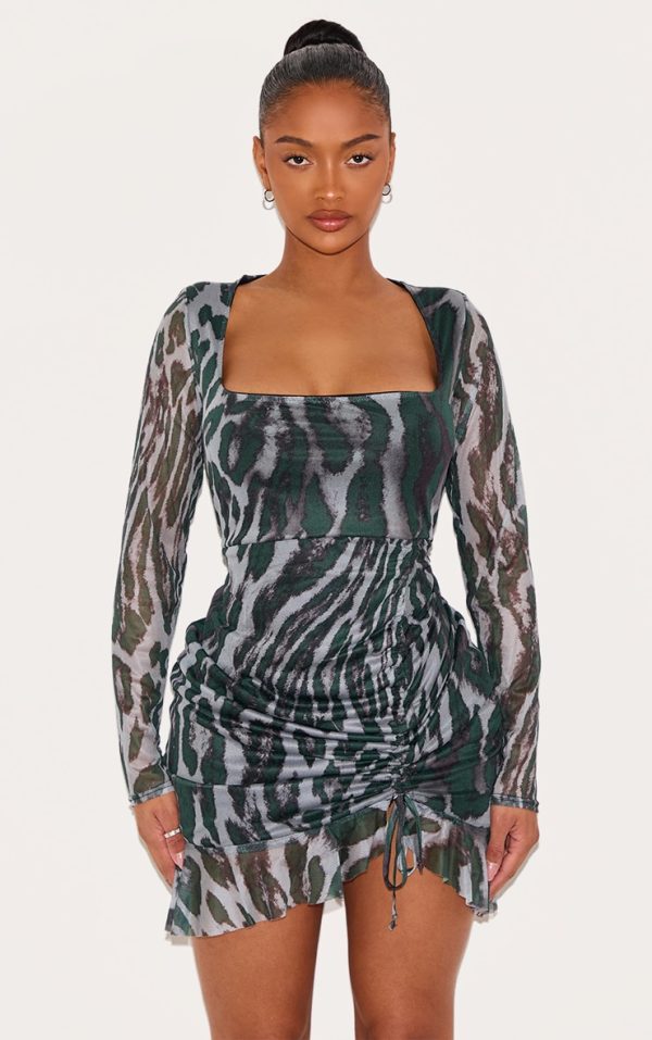 097fa78bacb4455349f51e6cf7c275fdf460391e_CNC8695_1_shape_green_abstract_print_mesh_long_sleeve_ruched_side_frill_hem_bodycon_dress