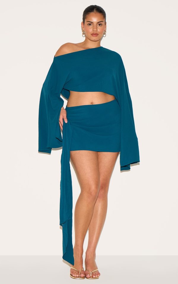 0aa137a5af403f62bae116081e3e1c410db88024_CNM7763_1_plus_teal_floaty_woven_knot_side_mini_skirt