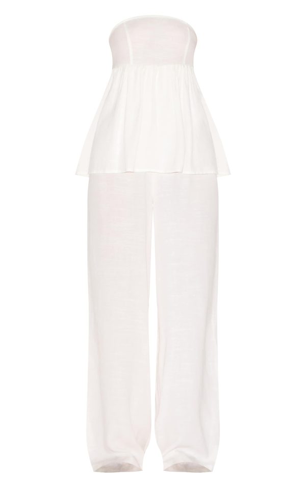0aeffeedcd904cee32f04ac29ae1942b98647538_CNM3884_5_white_bandeau_peplum_detail_jumpsuit