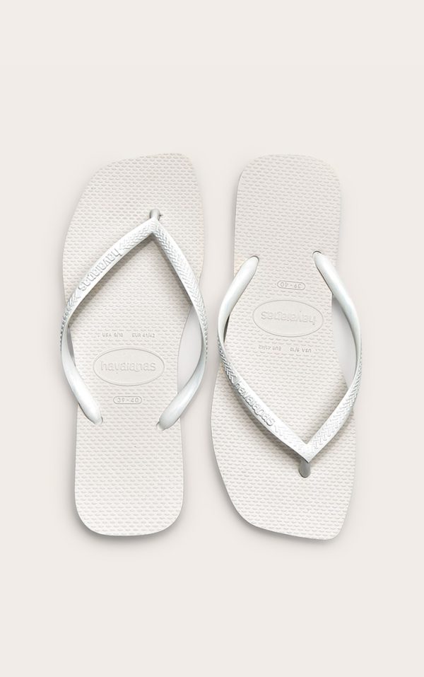 0b69bae79564574df9bfeafa4d5ca3e16266aa73_CNM1814_1_white_havaianas_slim_square_flip_flops