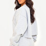 0e17f9000e0a0acc6562cdf47ff83b7ec12f93f7_CNJ8953_2_prettylittlething_tall_grey_marl_distressed_varsity_cropped_sweatshirt