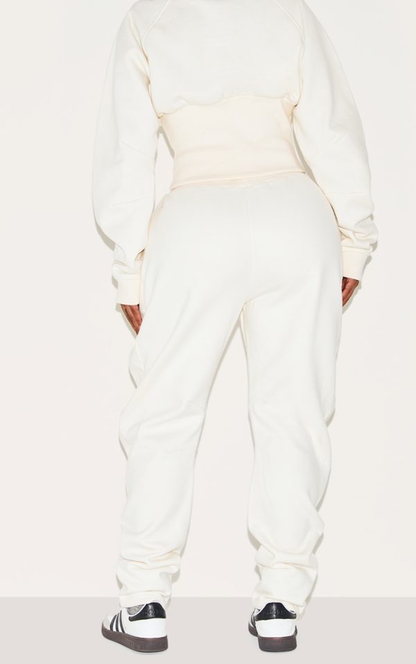 0ec0aaa314bf99e6ac65519f8cb46a359de6672e_CNM2583_3_shape_cream_high_waisted_pleat_front_cocoon_joggers-1