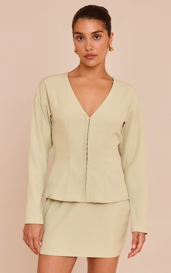 0f67373244c35293d458af98dd3aa56a503d763c_CNM7000_1_petite_soft_olive_collarless_hook_and_eye_cinched_waist_long_top