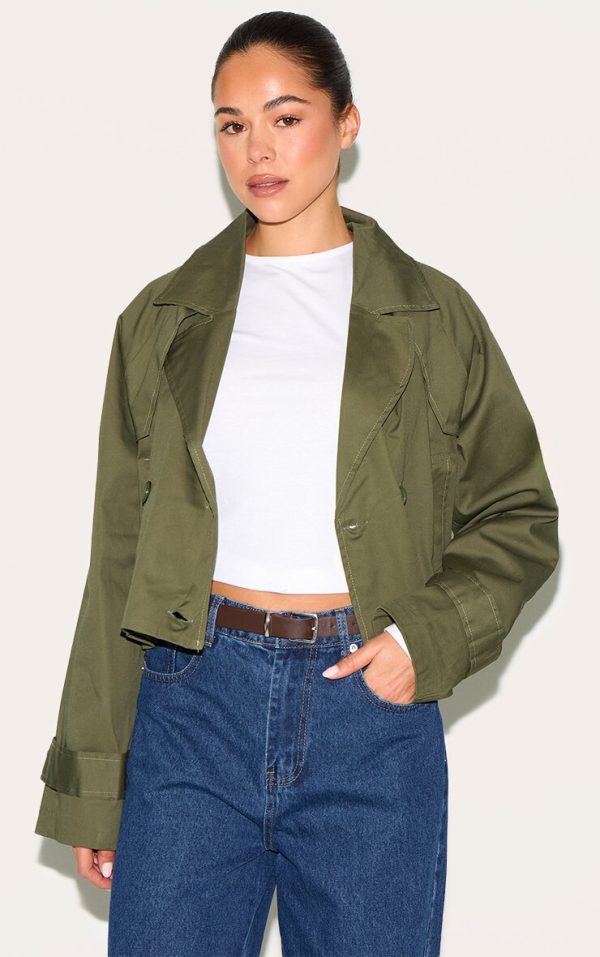 1025bb219c30e52cadc500d3b0dfd411911d3053_CNL4972_1_khaki_cropped_storm_flap_detail_trench_coat