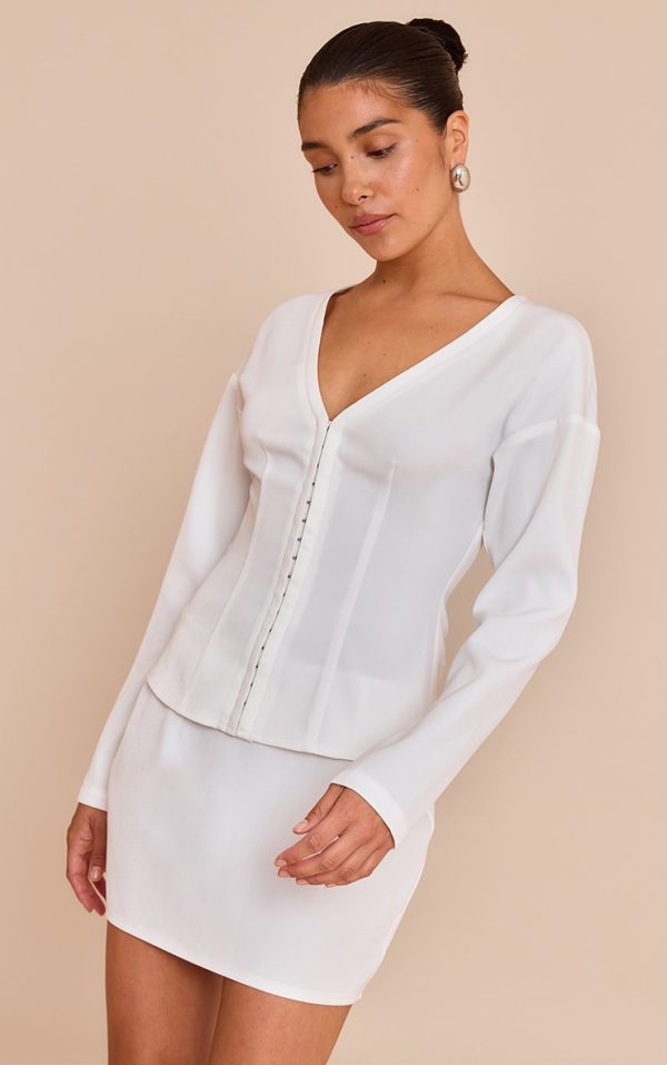 106aba9d81d602106d46e2ff4492c0ab392da91e_CNM7002_1_petite_white_mid_rise_mini_skirt