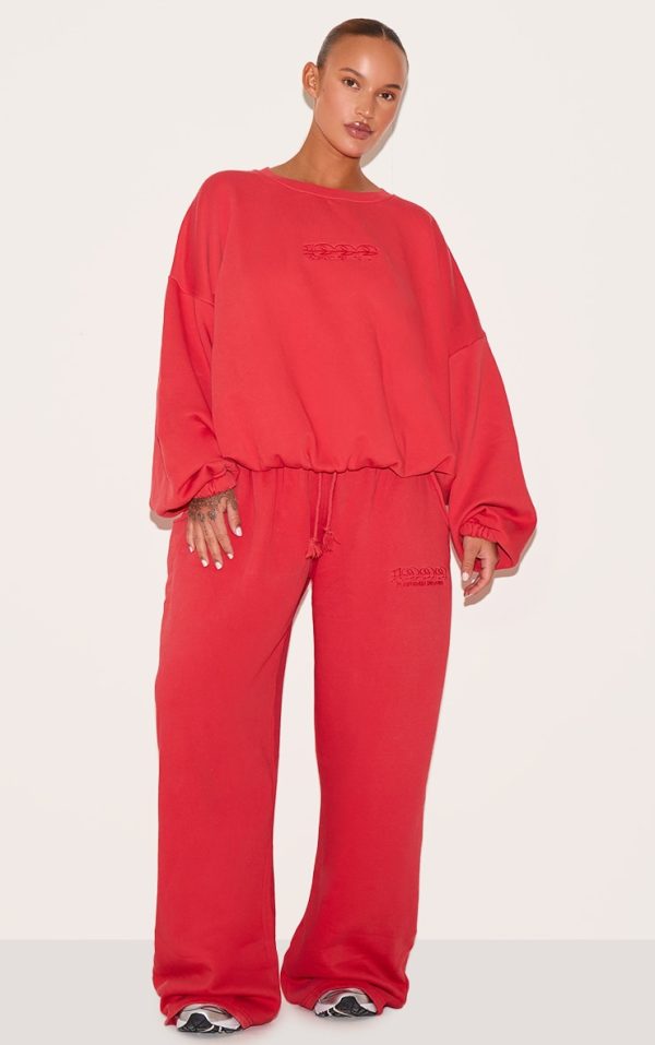 12afbd39ce6ce2198eaa318cf928e335af96a9f8_CNM6347_1_plus_red_prettylittlething_red_embroidered_straight_leg_joggers