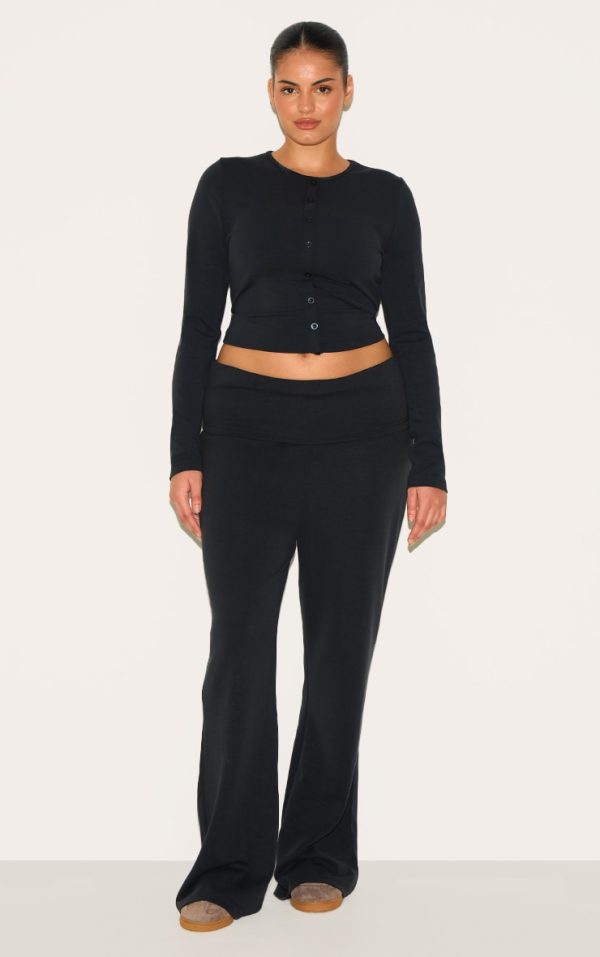 12d593beba317ac38a5ec6c71952f9c8b8fb4d12_CNM4453_3_plus_black_modal_button_detail_long_sleeve_top-1