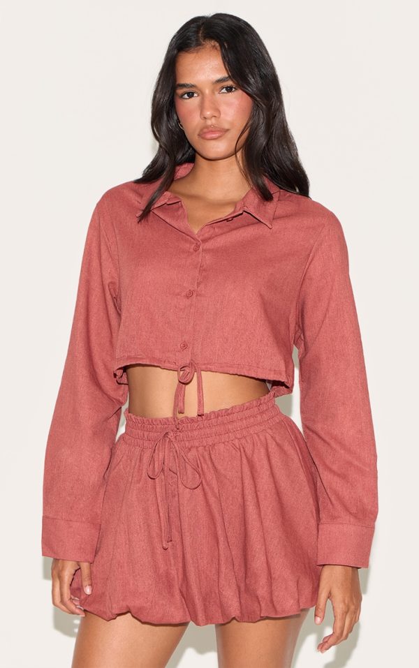 12d97a30986310b05b76541f8e8074cfd4bba852_CNM1731_1_rust_drawstring_puff_ball_skirt