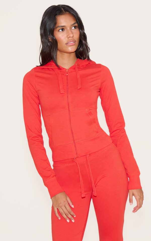 1558428357a1fd4d177254cc79f6ede7e6553b7c_CNN0640_1_deep_red_zip_up_fitted_track_top