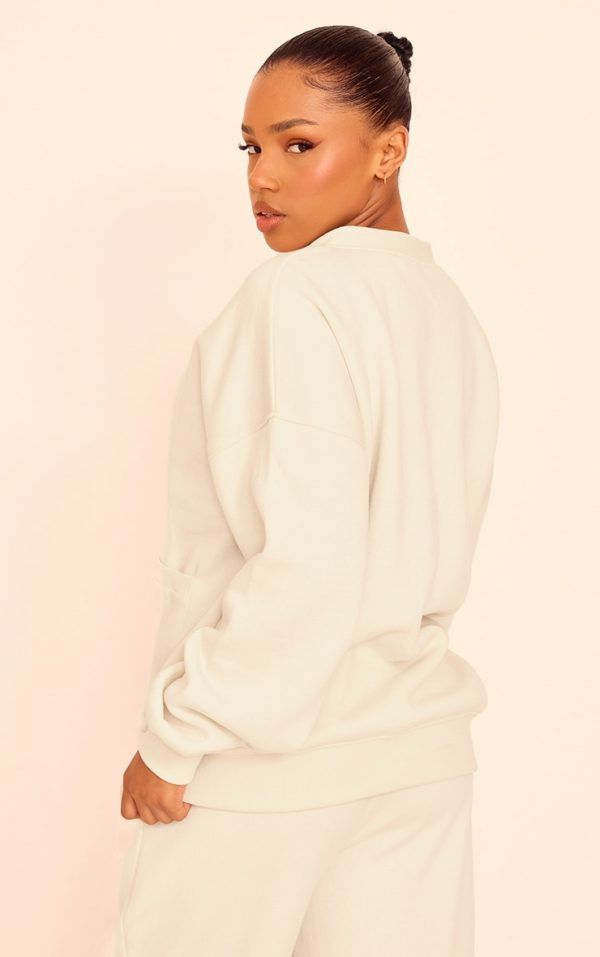 1625ab0fa7e1ba03dd08517ab4c01f0bf7b52682_CNJ8748_2_cream_button_front_pocket_sweat_cardigan