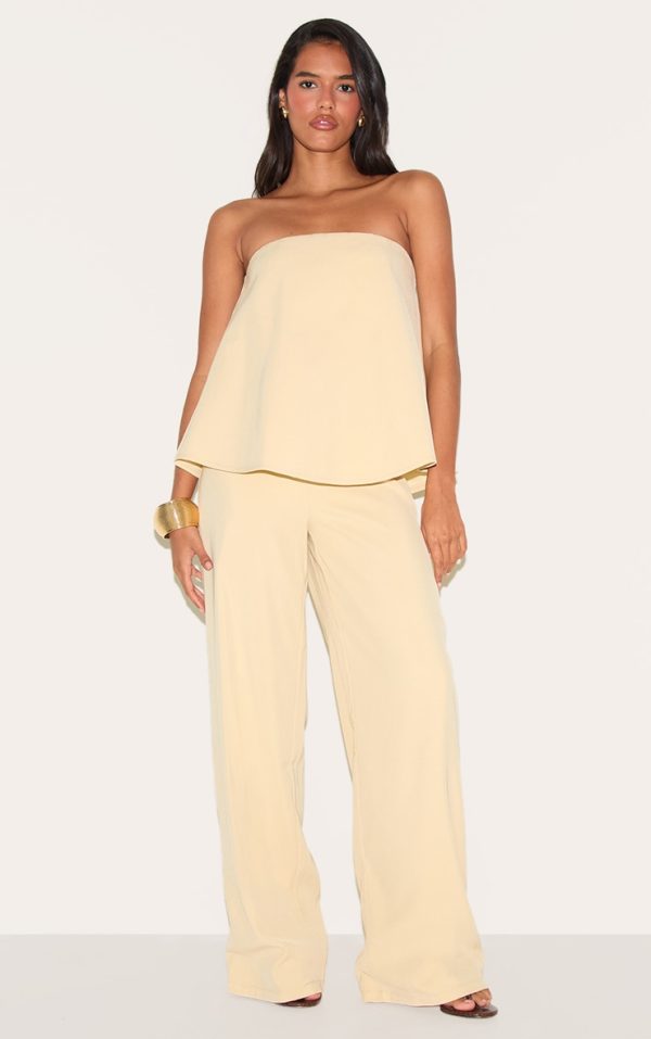 1ec3ea9379f29119497dd732ed757bd11d7c8daa_CNM7297_1_butter_yellow_structured_woven_peplum_straight_leg_jumpsuit