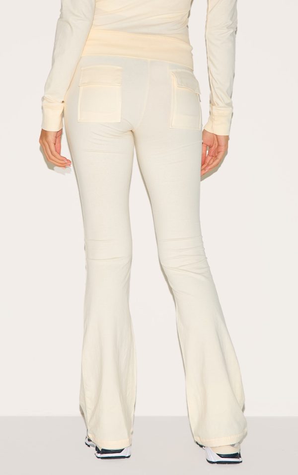 21d5f7e9d7ff9042ece62d874ee2d7f656cba5c1_CNM0344_3_cream_low_rise_skinny_flare_trousers