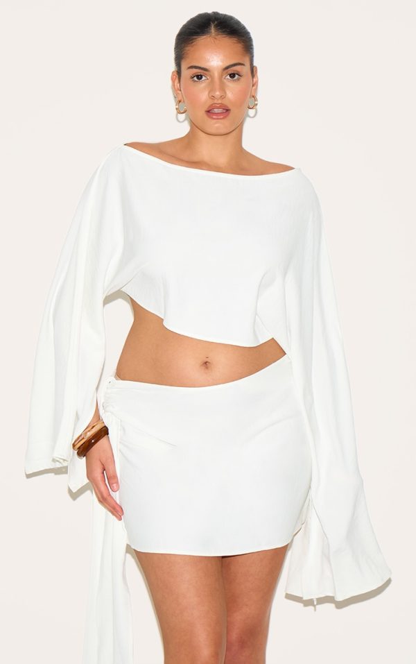 22f438b63d9f0738af73cc9a6b35f183336f9062_CNM7765_4_plus_cream_floaty_woven_knot_side_mini_skirt