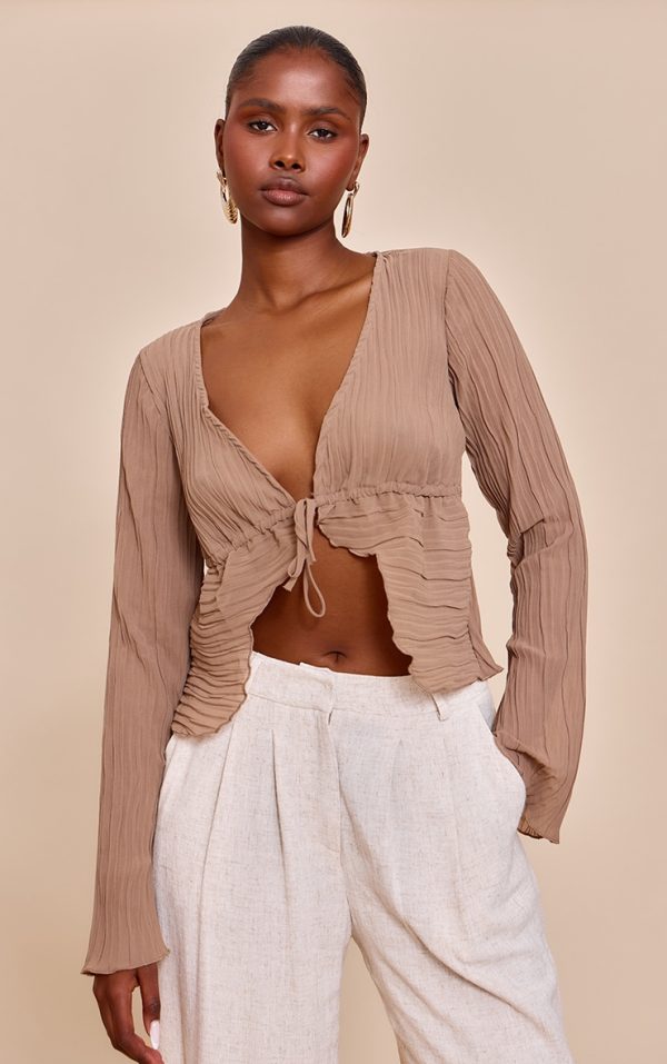 243def197d4898f11a77bad40e3a387df3f877fa_CNN0898_1_mushroom_sheer_plisse_tie_front_flute_sleeve_blouse