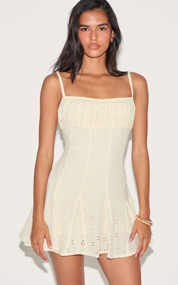 254bc6f92fbd06bd3ea663bc82618125cf6e1703_CNM3559_1_lemon_broderie_strappy_pleated_shift_dress