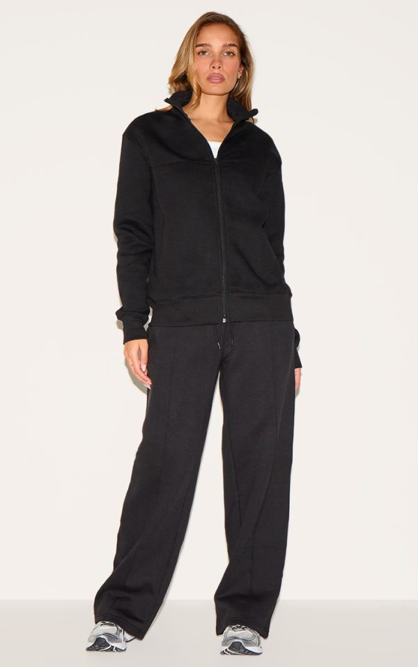 254e3babdf5985fca4d8684add99a0d02b2aa014_CNK9336_3_black_seamed_detail_zip_through_track_top