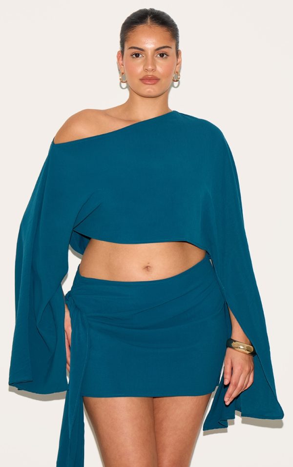 28481aac00081e1a42a9ecd07a742a92781b4d07_CNM7763_4_plus_teal_floaty_woven_knot_side_mini_skirt