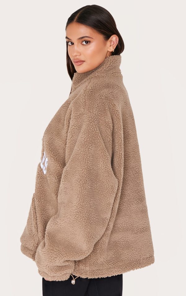 2ba6a6b3214a700d4fef57eeecc182c0d03f78e6_CNL1863_2_taupe_quarter_zip_pocket_detail_fleece