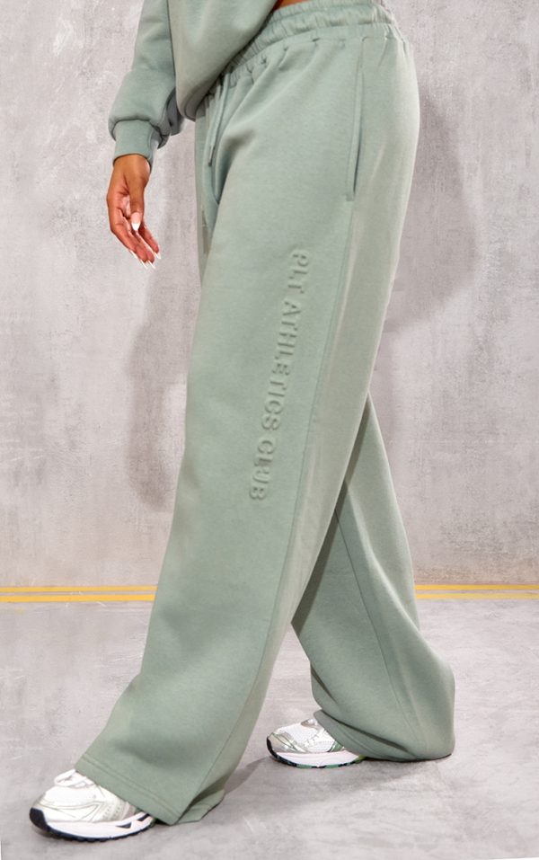2bcaf89dbb59a8b2bf8065b247624b8da245c6c5_CNK1767_2_prettylittlething_sage_athletics_club_embossed_straight_leg_joggers
