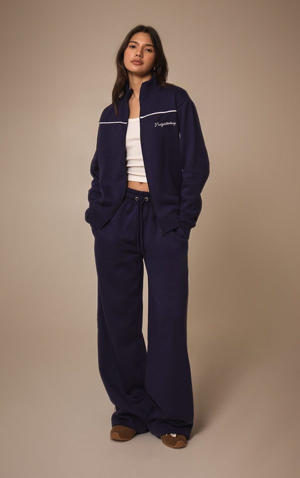 2bcdc11a62dcc9ba6c0260fcc750d3add2bbc88f_CNM4825_3_prettylittlething_dark_blue_contrast_piping_detail_zip_through_track_top
