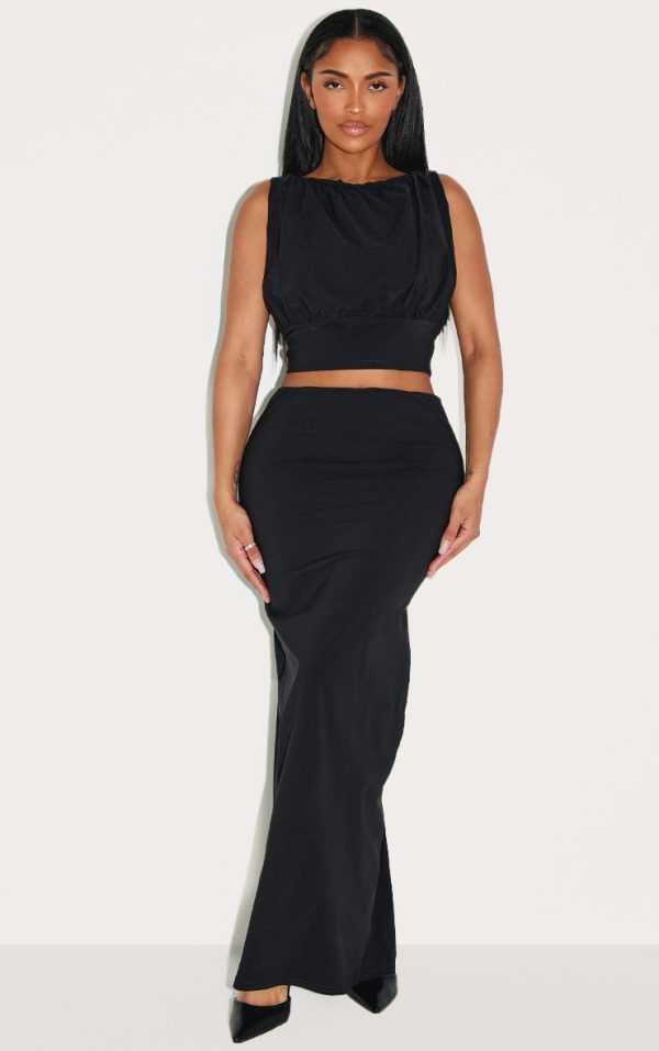 2d0d7a04a92ec080b17707ea2dd17594da33b4b2_CNM1028_1_shape_black_stretch_woven_high_waisted_maxi_skirt