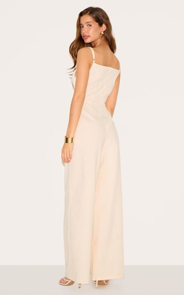 2e1f39291ca8c7db06a5c74b91726a208d1bc0b6_CNM7291_2_natural_linen_blend_boat_neck_bead_detail_jumpsuit