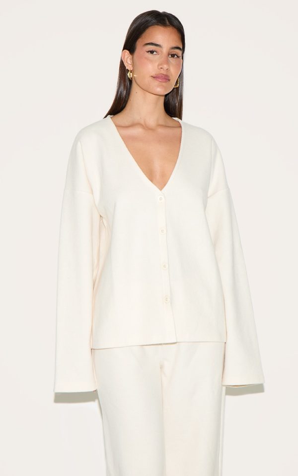 2e2a616528a869d71c9fb9b3c04a9af9bbaa3791_CNM8615_1_cream_heavy_brushed_rib_v_neck_button_up_cardigan