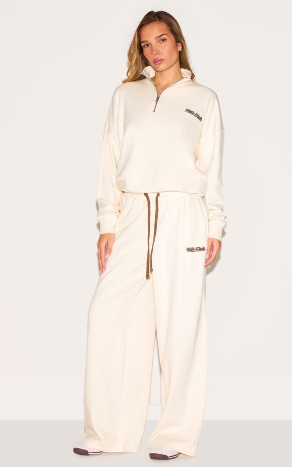 2f47e8236c683cd5c0cb2de33a8b43d93a79ea85_CNM4683_1_cream_run_club_puff_print_wide_leg_joggers