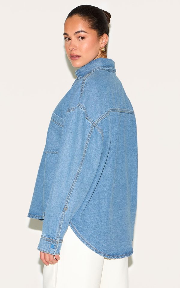 320fc6793af60083294d7298645dedf9b3adbe4f_CNL6618_2_mid_blue_wash_dip_hem_button_up_denim_shirt