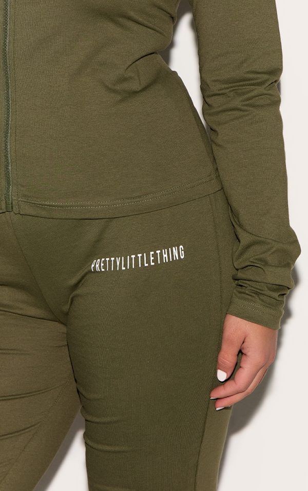 331b897c43a62c321a1bc575a79154a10dc9e917_CNH5589_4_prettylittlething_plus_khaki_jersey_skinny_flared_trousers