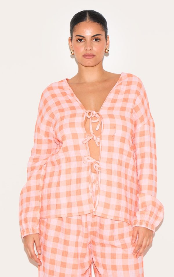 33606d488f58097b4dc913d82b5830303255373a_CNM3360_1_plus_orange_checked_cheesecloth_tie_front_long_sleeve_shirt