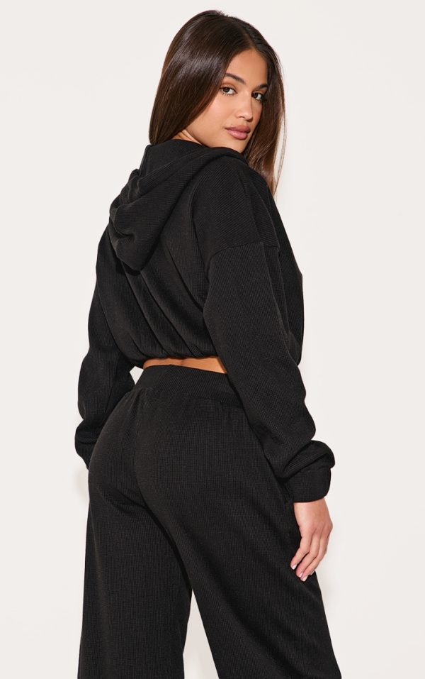 3390664c0e2eb416c363b8e8567a56b2b0b4555a_CNM0142_2_black_waffle_detail_hooded_cropped_jacket