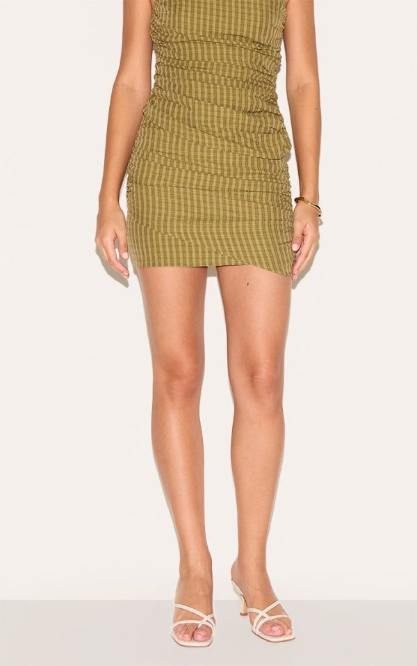 3535260ba3ced10483d55045ce29c0f3d2f88b36_CNM4531_2_tall_moss_green_check_ruched_mini_skirt