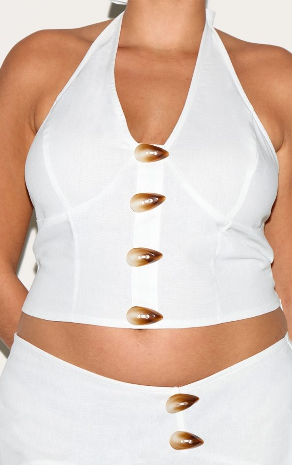35452509bba5413ee6286533e4316c39fa5f3367_CNN0786_4_plus_white_woven_halterneck_button_detail_top