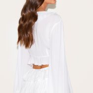 3570997942bcabe8abdf9f7aabc55e72227aff81_CNM3231_2_white_cheesecloth_ruffle_tie_front_long_sleeve_top
