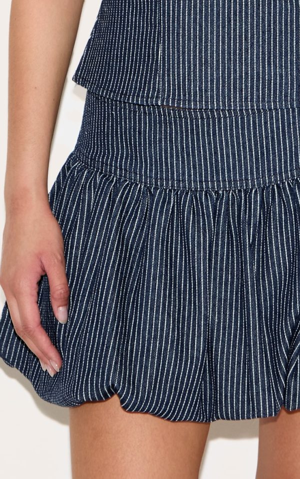 36b134b30844cde169723c84d12669a753c2d150_CNL7946_5_navy_pinstripe_denim_puffball_mini_skirt