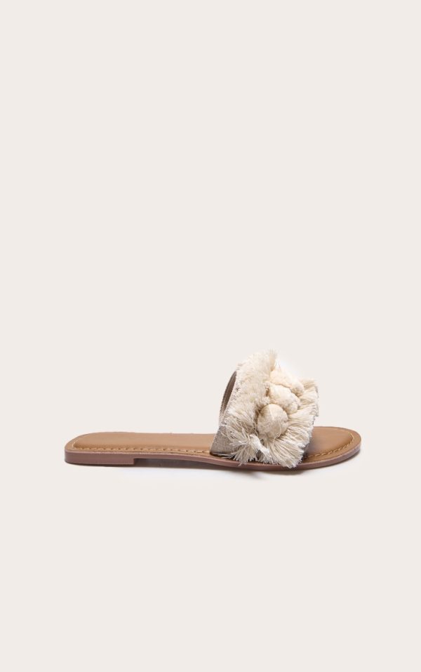 379912f0db69f091f164bfb70eaff1953a30f25b_CMA0007_1_nude_tassel_pom_pom_mule_sandal
