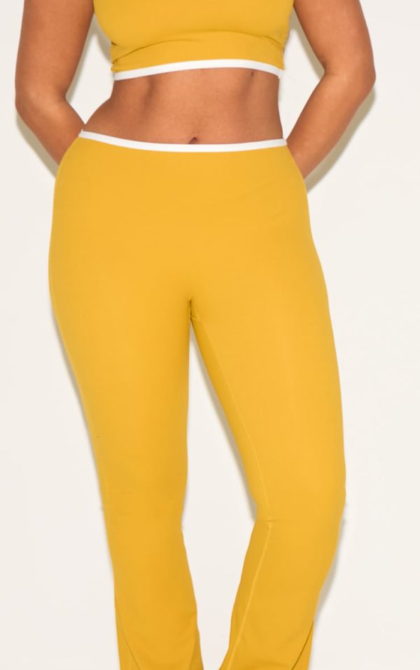 37a86a03864bfb23d3ba5be6ca9231e17e43694a_CNM6437_4_shape_olive_sculpt_active_contrast_binding_flare_trousers