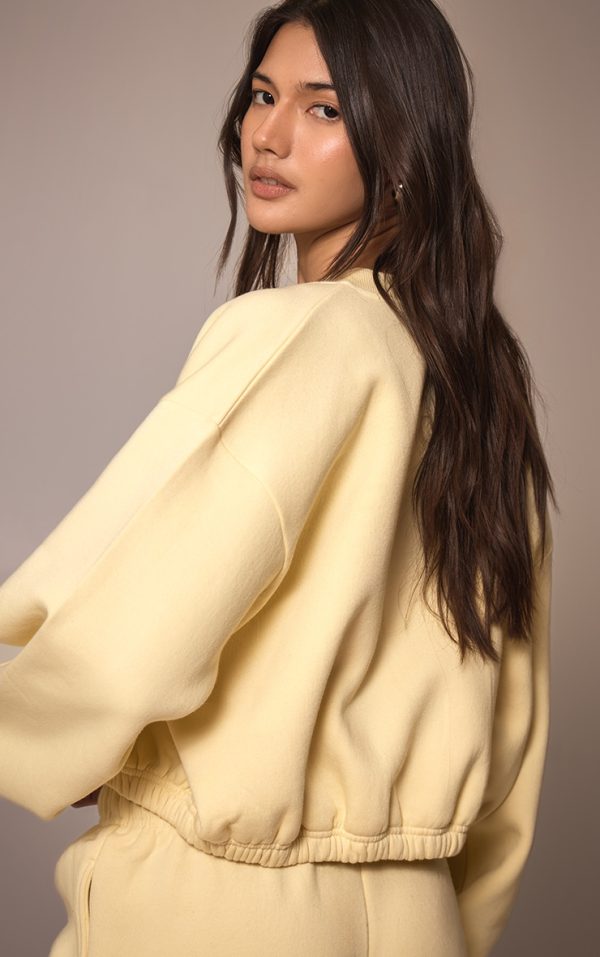3827e196e91f957642c61f0358dbc76582f91ea2_CNM9984_2_butter_cream_drawcord_waist_cropped_zip_up_sweatshirt