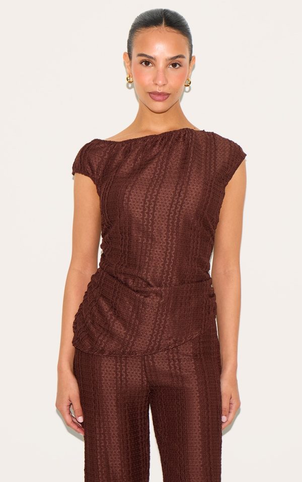 38dfd007d06a7eea9fd93aa55378c3909b4d7968_CNN1060_1_petite_chocolate_asymmetric_textured_off_shoulder_top