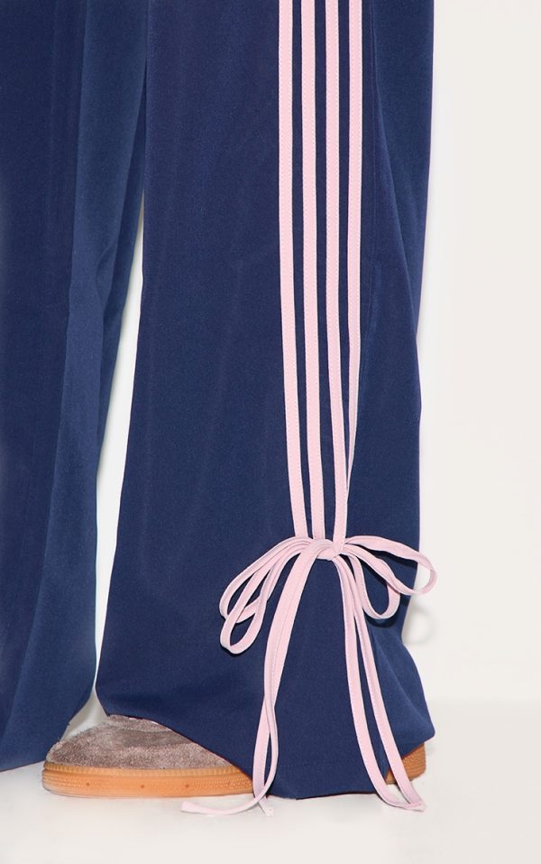 3991083cea9a6b53d2c96d7bd2a5ef50e9749264_CNK3664_4_navy_shell_bow_detail_track_pants