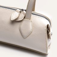 3cbc8283af23ae2d2d0e99d612de35ecd9af50e4_CNN2201_5_white_textured_faux_leather_bowler_bag