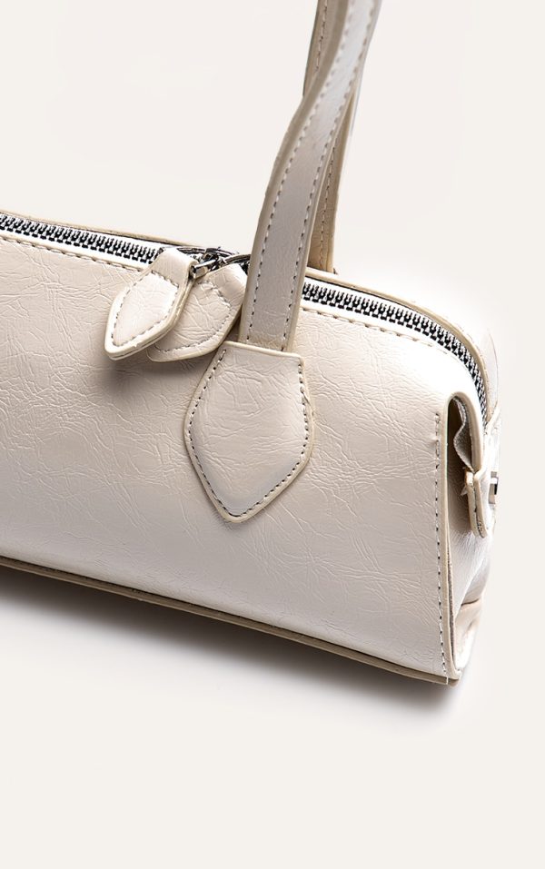 3cbc8283af23ae2d2d0e99d612de35ecd9af50e4_CNN2201_5_white_textured_faux_leather_bowler_bag